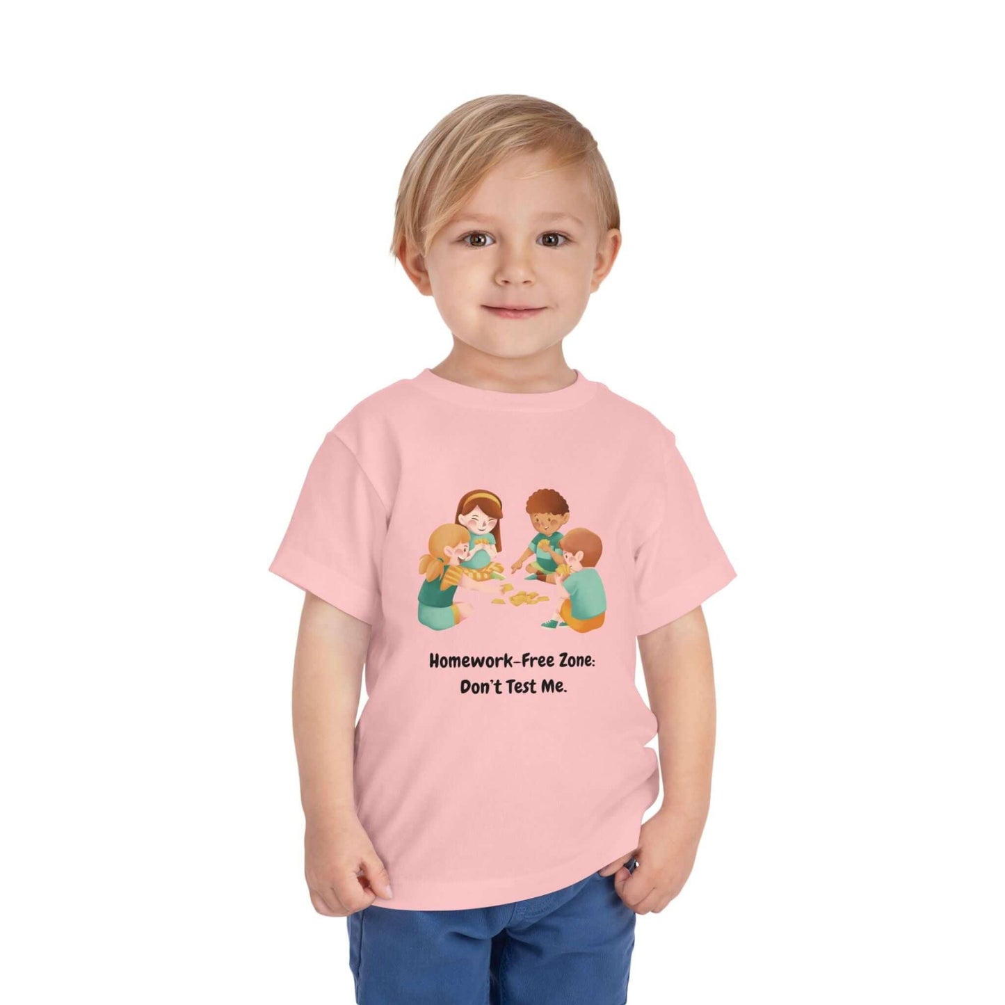 Toddler wearing a pink 'Homework-Free Zone: Don't Test Me' funny t-shirt, made of 100% cotton, perfect for kids' playful wardrobe.