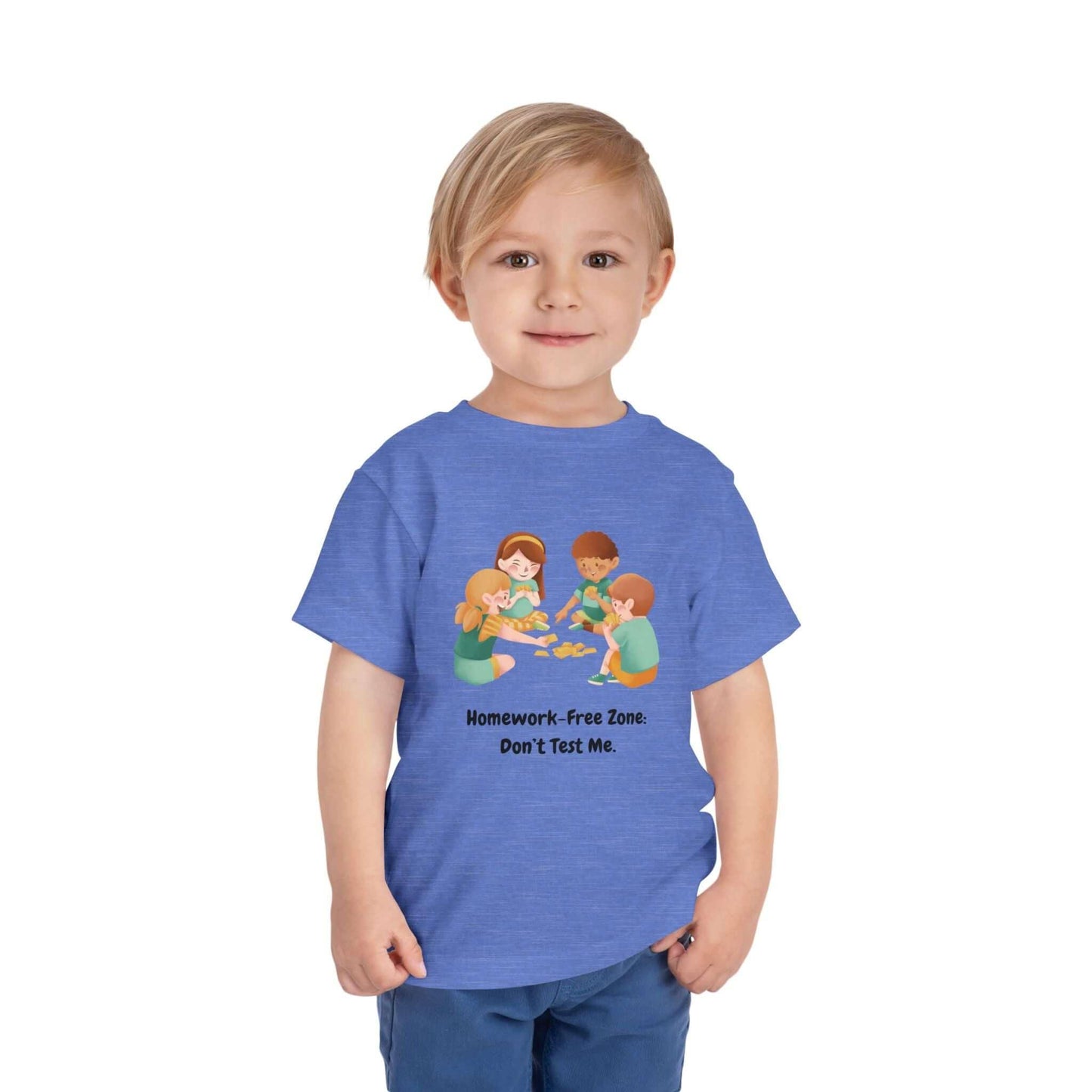 Toddler wearing a blue 'Homework-Free Zone' funny t-shirt, featuring kids playing. Made from 100% Airlume cotton.