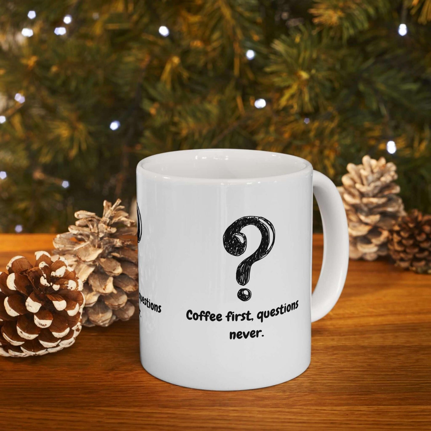 Funny ceramic coffee mug with 'Coffee First, Questions Never' design; perfect holiday gift, microwavable and dishwasher-safe.