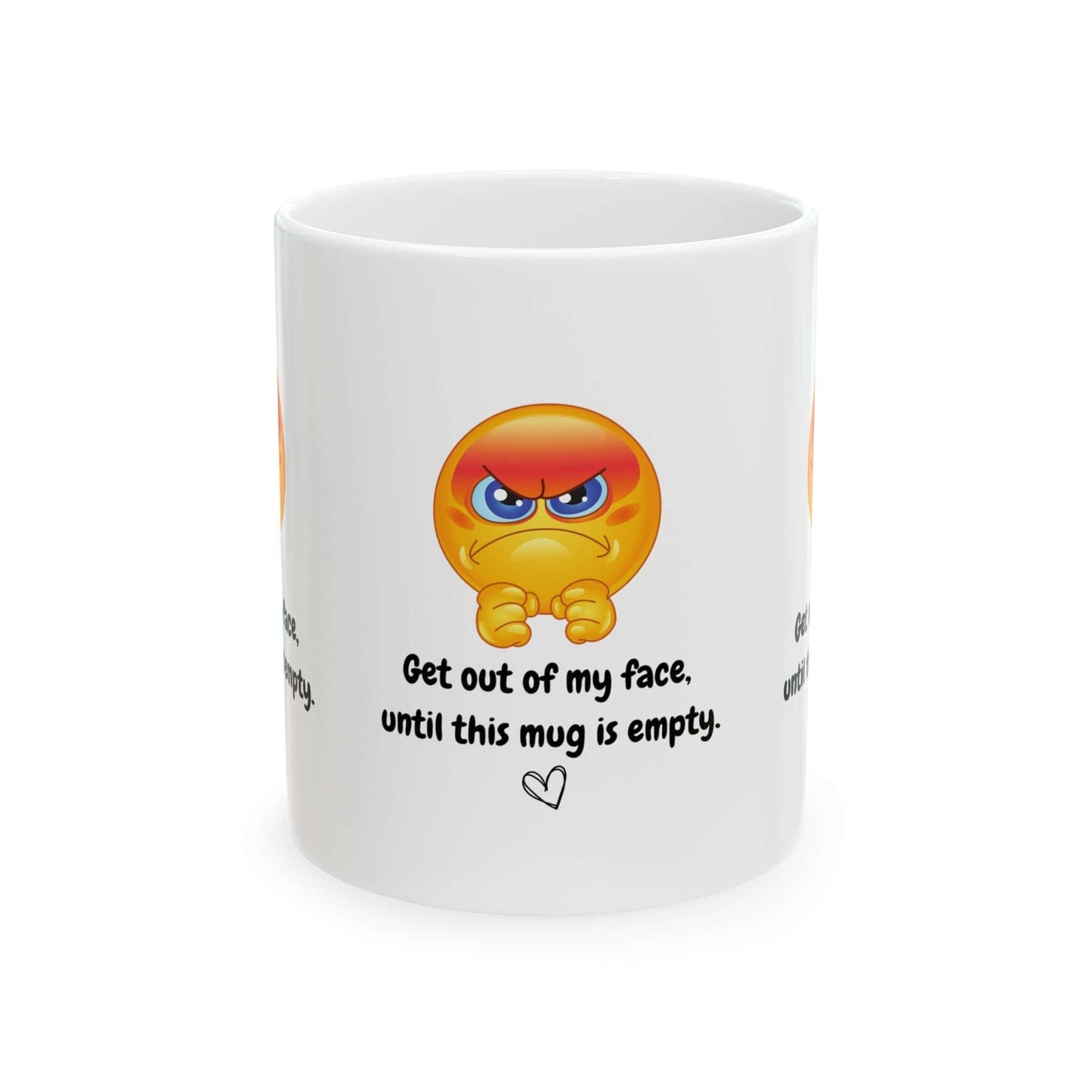 White ceramic mug with funny angry emoji and text 'Get out of my face until this mug is empty' design.