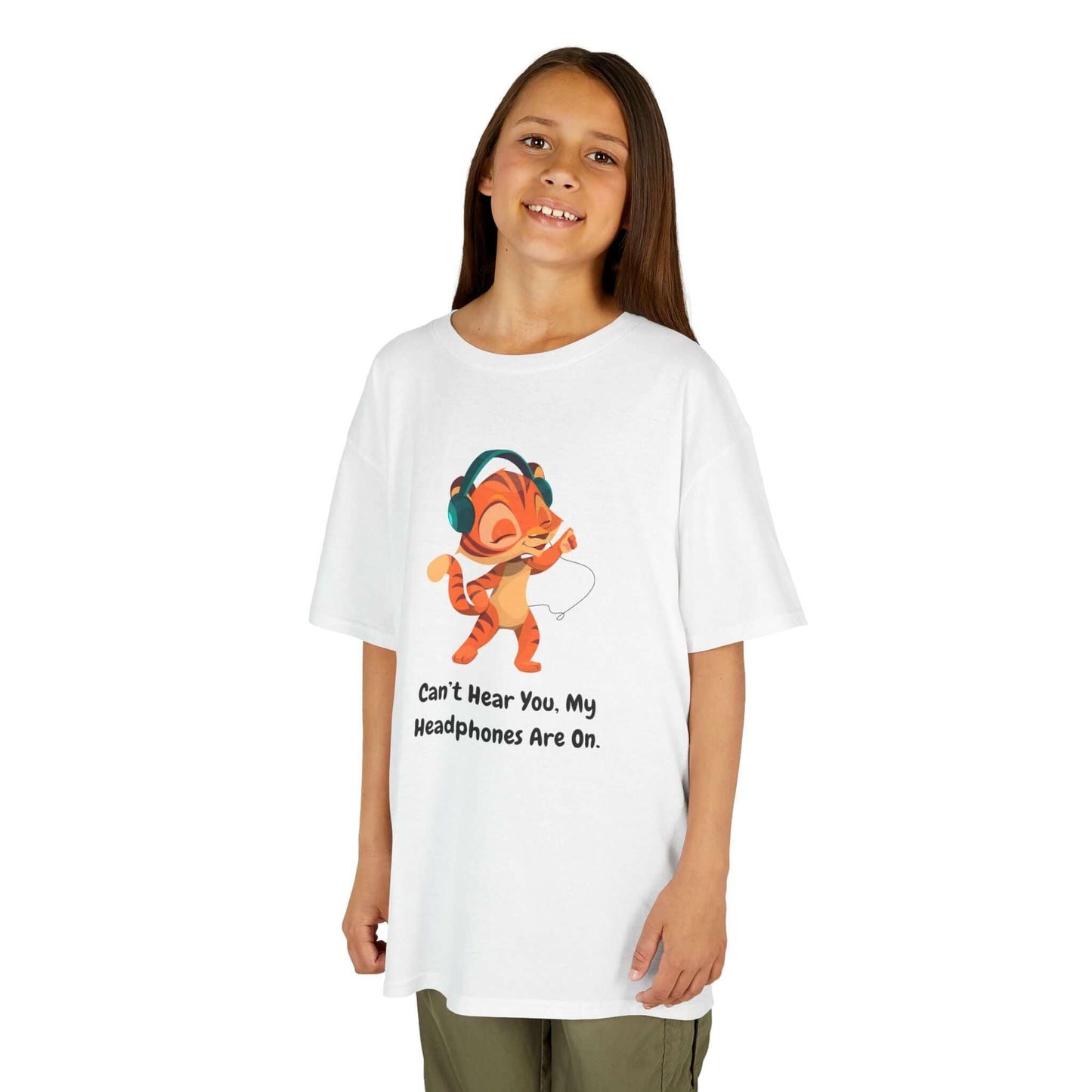 Child wearing a funny white t-shirt with cartoon and 'Can't Hear You, My Headphones Are On' text, perfect for kids, cotton fabric.