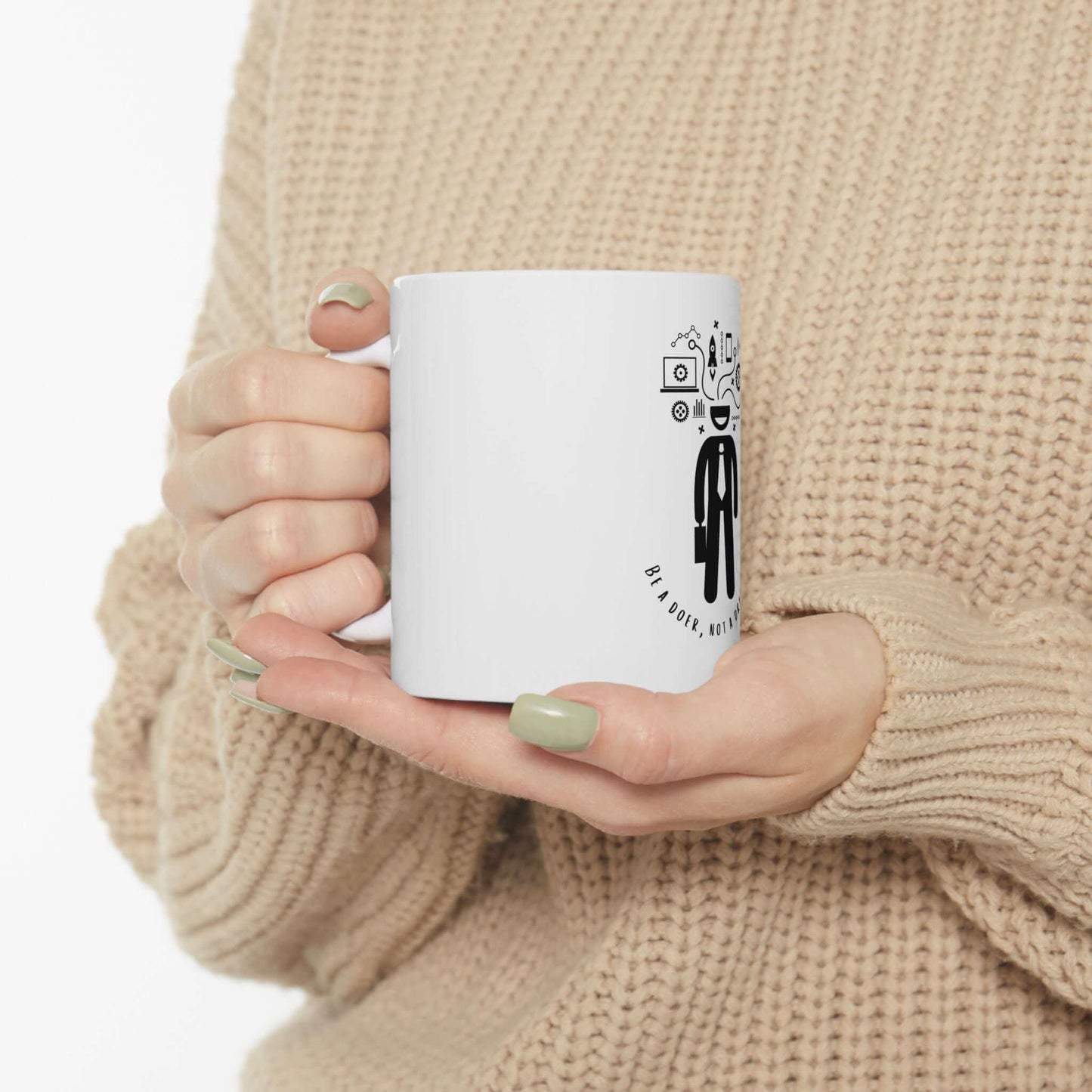 Person holding 'I'm a Doer, not a Dreamer' ceramic mug in beige sweater.