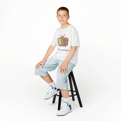 Kid wearing Straight A's funny T-shirt sitting on stool, showcasing graphic TV print, durable collar, and seamless side design.