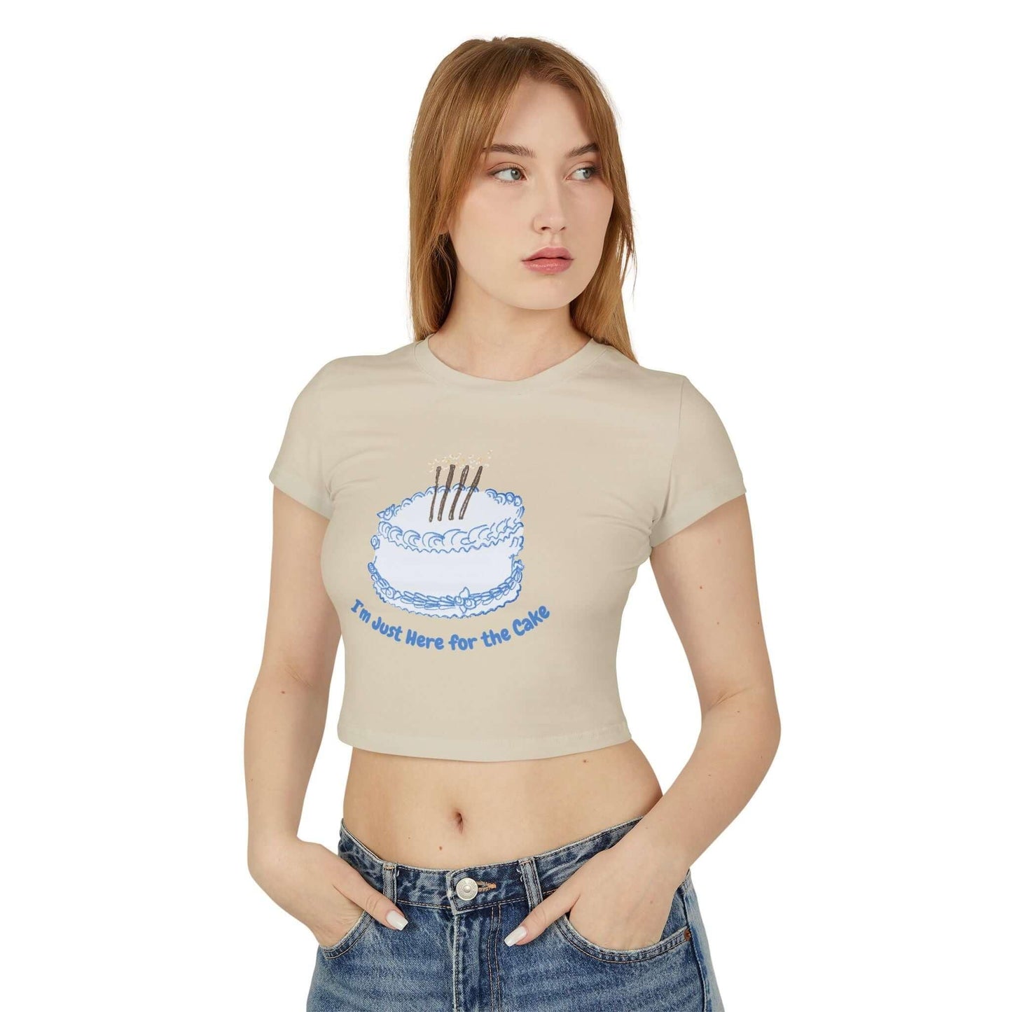 Woman wearing a slim-fit baby tee with a "Came for the Cake" graphic, made from 100% organic cotton.