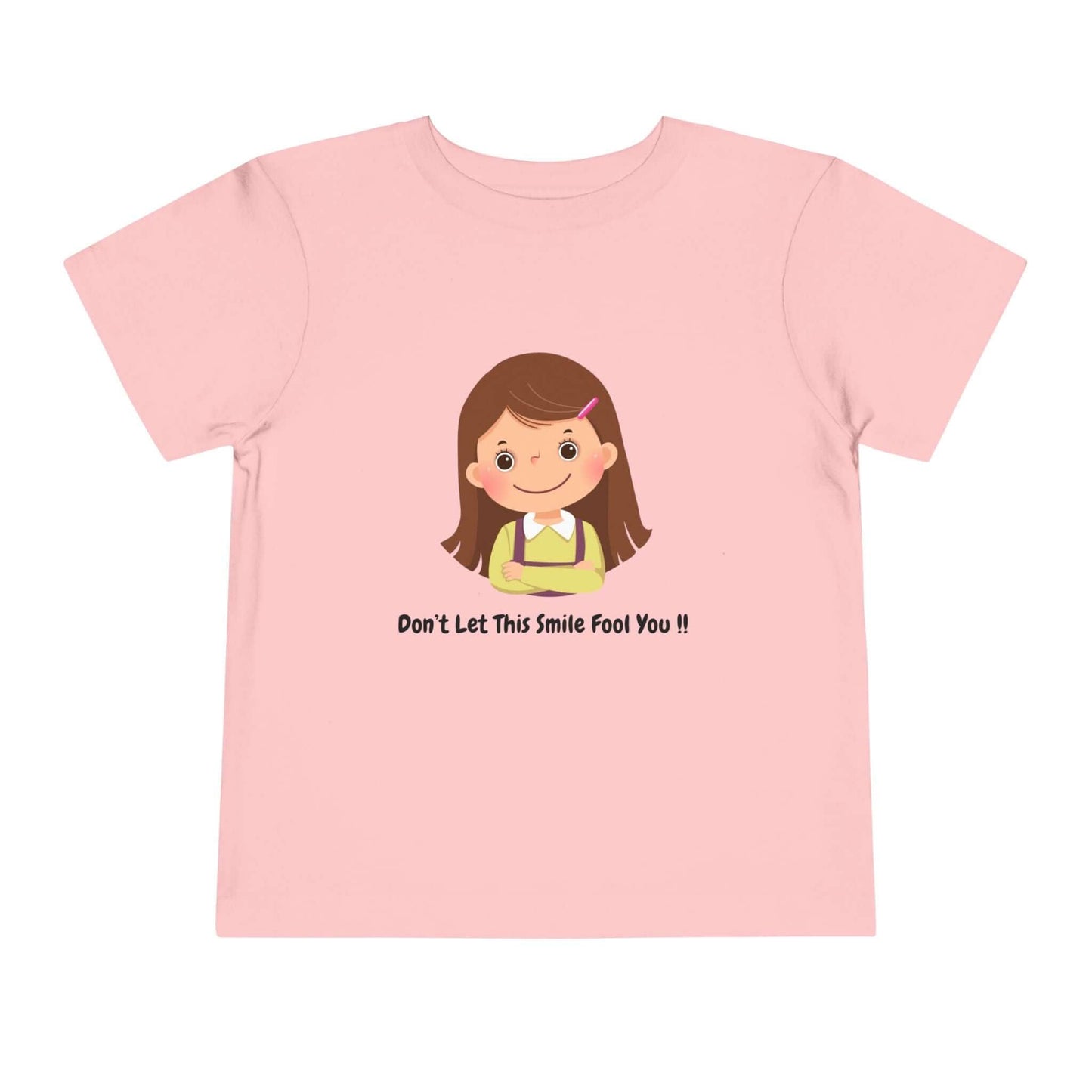 Funny toddler t-shirt with "Don't Let This Smile Fool You" print on pink Bella Canvas cotton, perfect for kids' wardrobe.