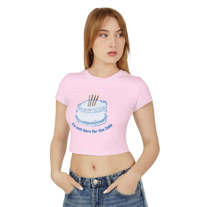 Women's baby tee with 'Came for the Cake' design, slim fit, 100% organic cotton, medium fabric, model wearing pink shirt and jeans.