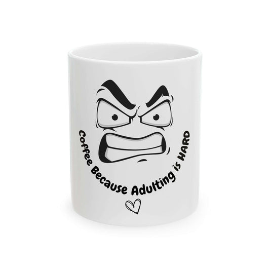 Funny ceramic mug with text 'Coffee Because Adulting is Hard' and angry face illustration, suitable for 11oz or 15oz sizes.