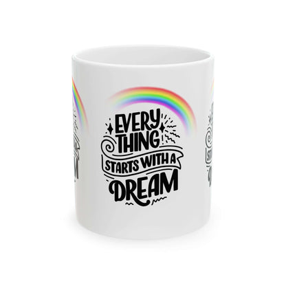 White ceramic coffee mug with 'Everything Starts with a Dream' and colorful rainbow design, available in 11oz and 15oz sizes.